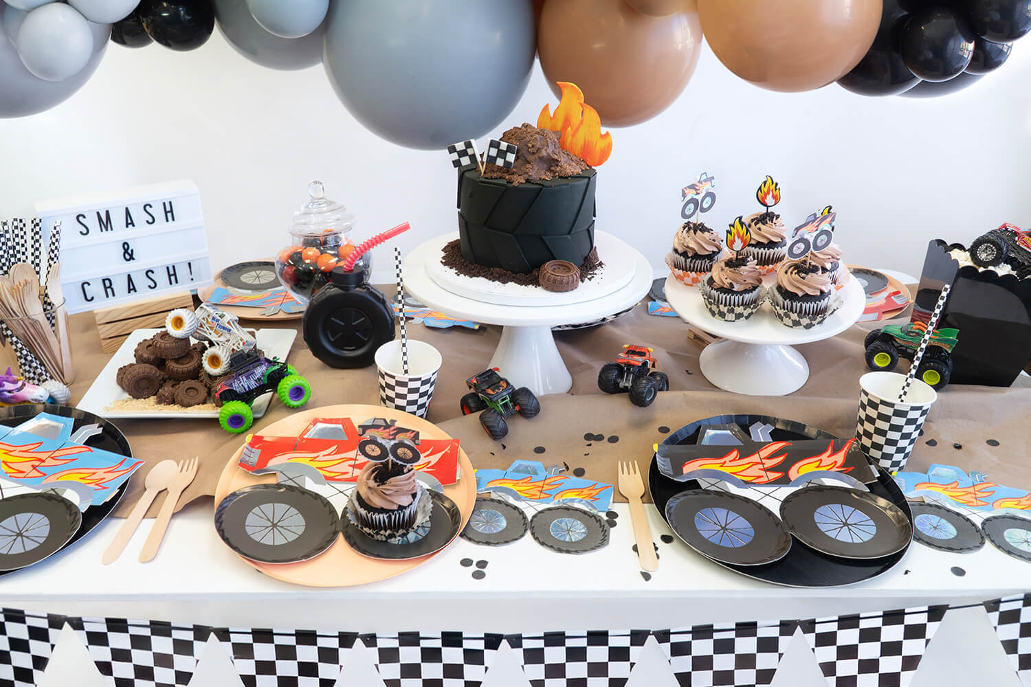 A fun kid's monster truck themed party by Momopartys featuring various monster truck themed tableware and decors.