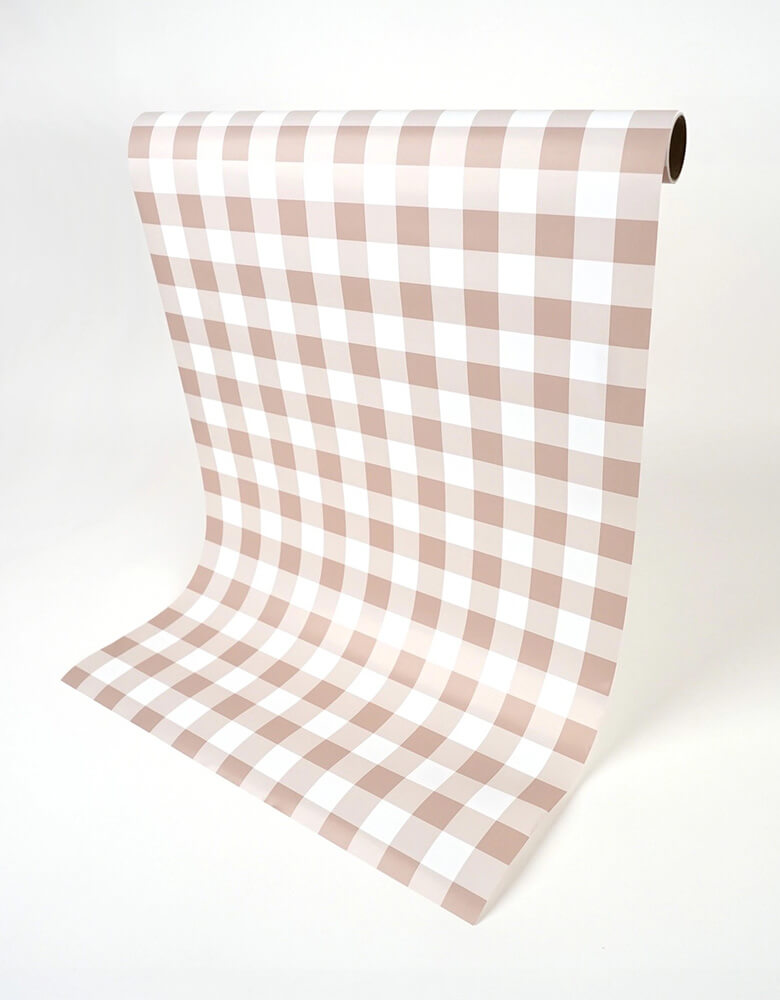 Momo Party's 18" x 120" Brown Gingham Paper Table Runner by Gatherings. Bring the merriest of moments to your holiday table with this stylishly plaid brown gingham table runner! From buffets to family dinners, this festive pattern will add a touch of classic, cozy charm that will warm up any home. Perfect for the fall holidays! Add a ravishing look to your table top with our uniquely created table runners, making your table appear more lavish. Our table runners are 100% recyclable which helps with a swift!