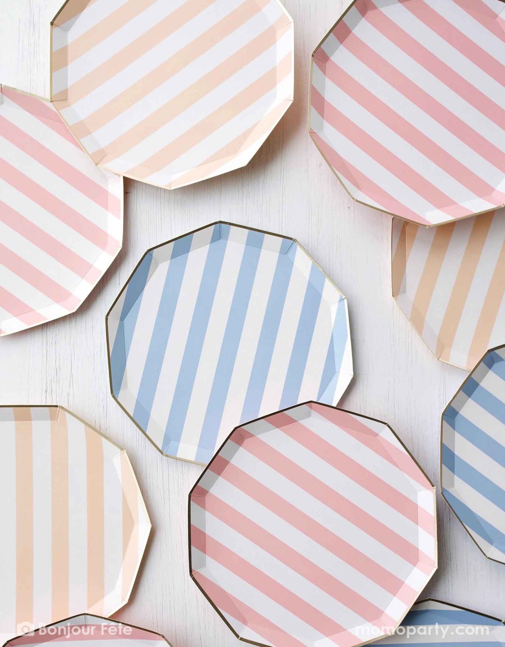 A table full of Momopartys's 10.75" Cabana Striped Paper Plates in different pastel colors including peach, pink and blue. These elegant blue sky decagon dinner plates feature a charming pastel stripe pattern for a soft touch. Perfect for adding a pop of color to your next gathering.