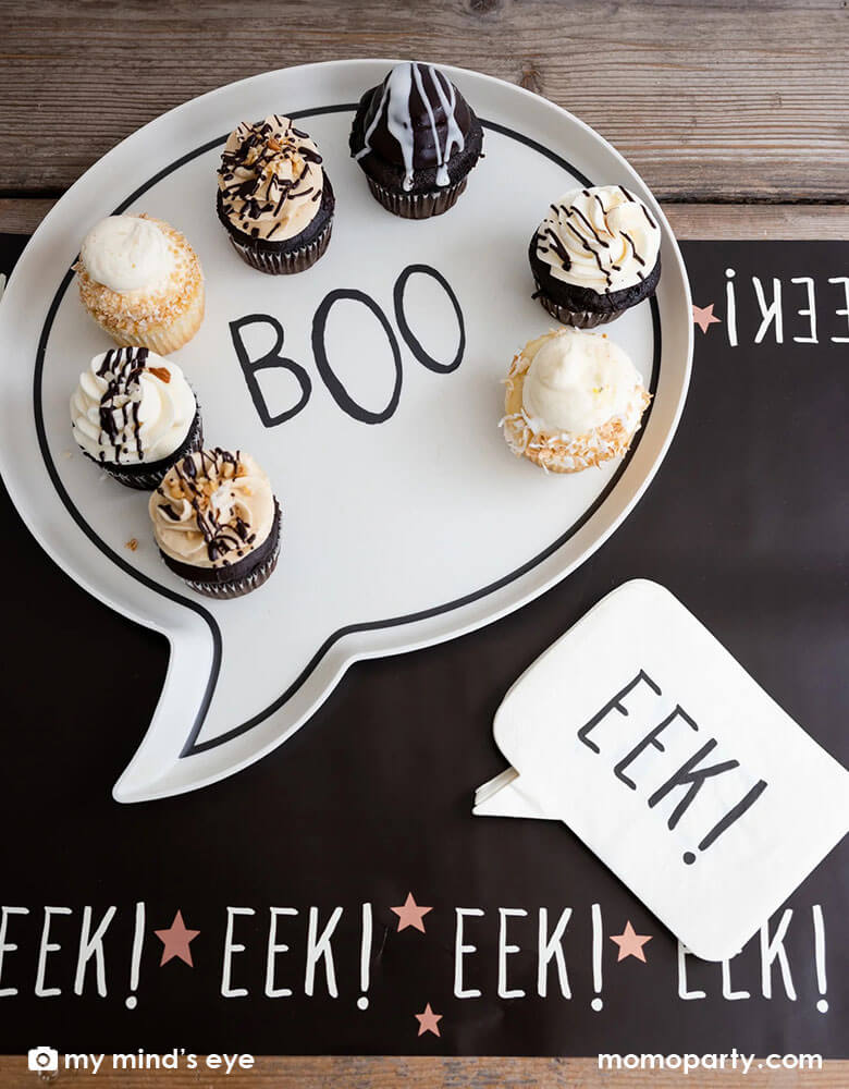 A fun Halloween table featuring Momopartys's Boo Reusable bamboo tray and Eek! napkins on the Frank & Mummy Eek! Table Runner by My Mind's Eye. Featuring the spooky phrase "Eek!' and copper foil stars this table runner is the perfect addition to the table at your Halloween gatherings.