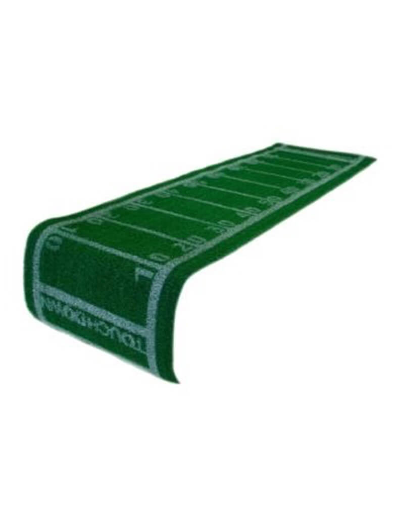 Momo Party's 5ft x 16 inches Football Turf Table Runner by Talking Tables. Decorate your table for game day with this amazing Football Turf Table Runner. This grass runner features yard line markings and touchdown zones just like a football field. Layer this table runner on top of your party table cover to complete your tablescape. Perfect as a football party decoration for the Super Bowl party, game day or a kid's football-themed birthday party.