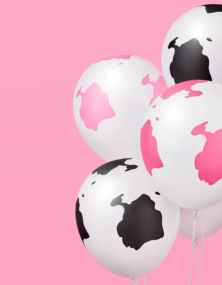 Momo Party's Pink Cow Print Latex Balloon Mix by Xo, fetti. Comes in 24 matte cow print latex balloons, including 8 light pink, 8 hot pink and 8 black balloons, these latex balloons are perfect for girl's farm, barnhouse, rodeo, Western themed birthday party or a disco cowgirl bachelorette party.