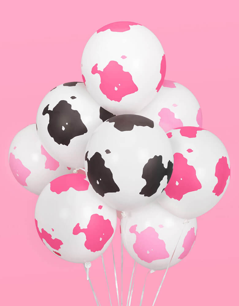 Momo Party's Pink Cow Print Latex Balloon Mix by Xo, fetti. Comes in 24 matte cow print latex balloons, including 8 light pink, 8 hot pink and 8 black balloons, these latex balloons are perfect for girl's farm, barnhouse, rodeo, Western themed birthday party or a disco cowgirl bachelorette party.