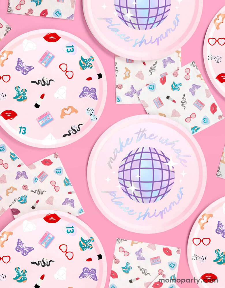 Momo Party's 9" x 9" Taylor Swift Era's Party Paper Plates and 5" small party napkins by Xo, Fetti. The plates come in a set of 24 paper plates in two different designs, a disco ball and a Taylor Swift inspired motif featuring red lipstick, red lips, butterflies, cowgirl boots, snakes, cassette tapes, guitar picks, heart hand symbols, and heart shaped sunglasses. They're perfect for the party table celebrating your Swiftie girl's special day.