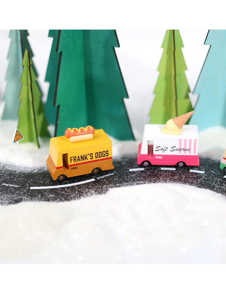 Candylab Candyvan Hot Dog Van and ice cream van driving on an asphalt road