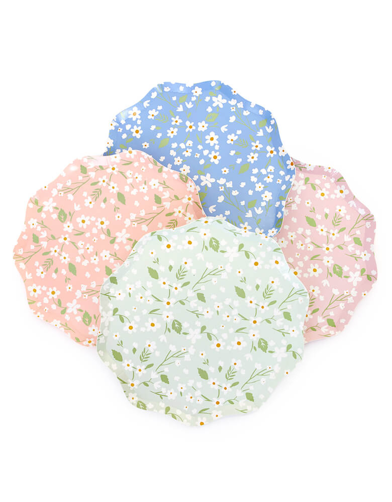 Ditsy Floral Side Plates By Meri Meri. Features a fabulous floral pattern with a stylish scalloped edged paper plates. Pack of 12 in 4 colors: blue, green, pink and peach. Made from eco-friendly paper. Add a touch of springtime beauty to your party table with these high quality, well designed party plates.