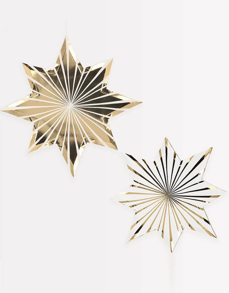 Meri Meri Gold Stripe Star Plates, Sold by Momopartys. Elevate your holiday party table with these fabulous Plates! These paper plates are cleverly crafted with two designs that mirror each other - one is white with gold foil details and in die-cut shape, and the other features gold foil with white details. They are the perfect colors to complement your gold and silver New Year's Eve party, Christmas party, or graduation celebration.