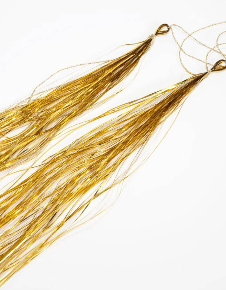 A close up of the old tinsel from Meri Meri Rainbow Balloon garland Arch Kit