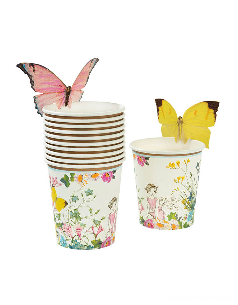 Truly Fairy Paper Cups with Butterfly Detail by Talking Tables . These cups Featuring a beautiful floral fairy setting design, these cups come with sweet butterflies to attach to the top of your cups, adding that extra touch of magic. A brilliant addition to your table if you’re in search of fairy styled party ideas. These cups look great with our Truly Fairy paper plates and napkins, to create a magical fairytale setting. Each pack contains 12 paper cups with butterflies in 2 different designs.