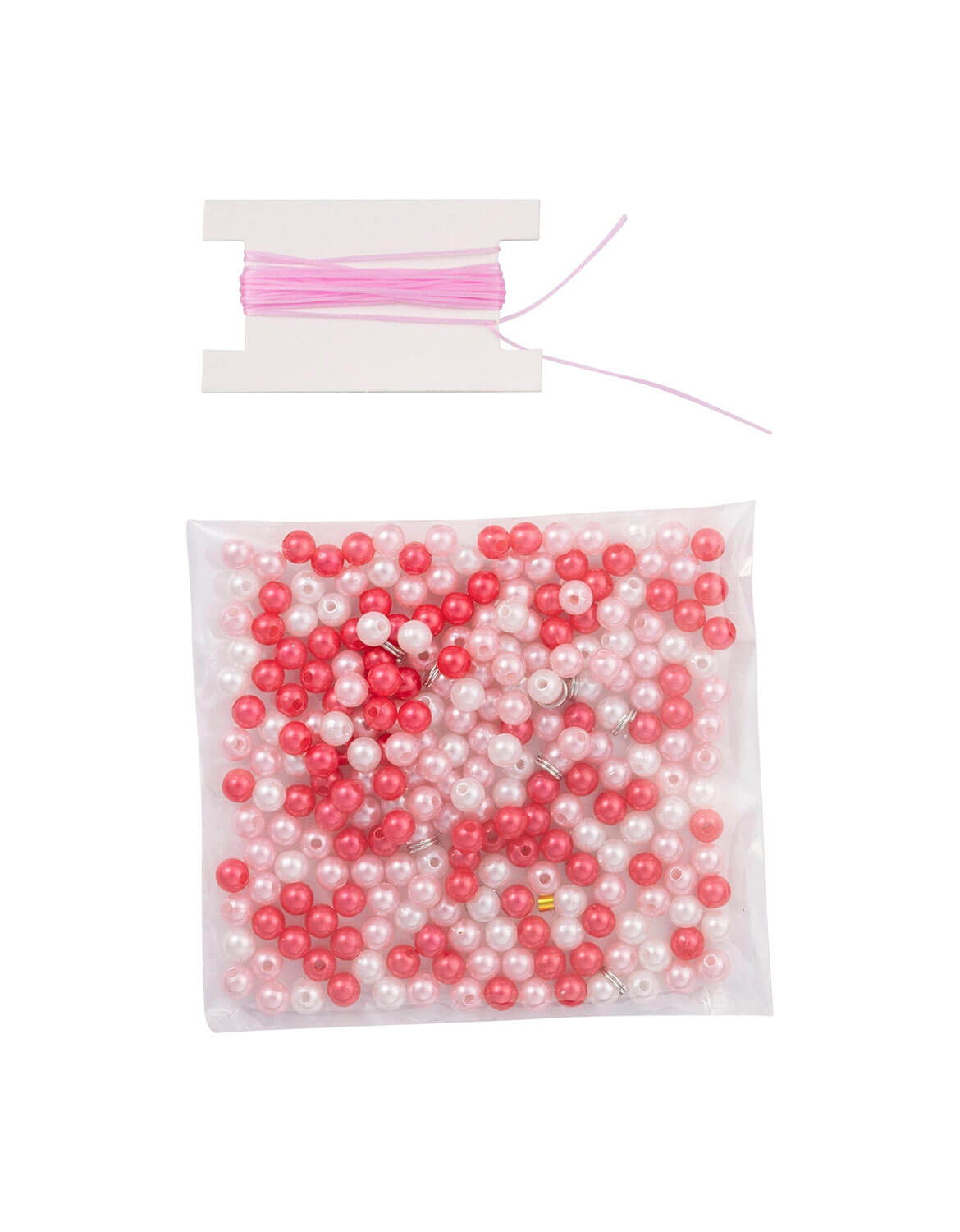 Bag of pink and white beads with a spool of thread on a white background.