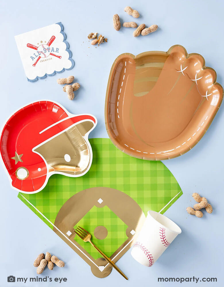 A baseball themed party collection by Momopartys featuring baseball paper tableware by My Mind's Eye, including baseball mitt shaped paper plates, baseball red helmet shaped plates, baseball field shaped placemats, baseball all star small napkins and baseball party cups, along with some peanuts as party snacks, this makes a great inspiration for kid's baseball themed birthday party decoration ideas.