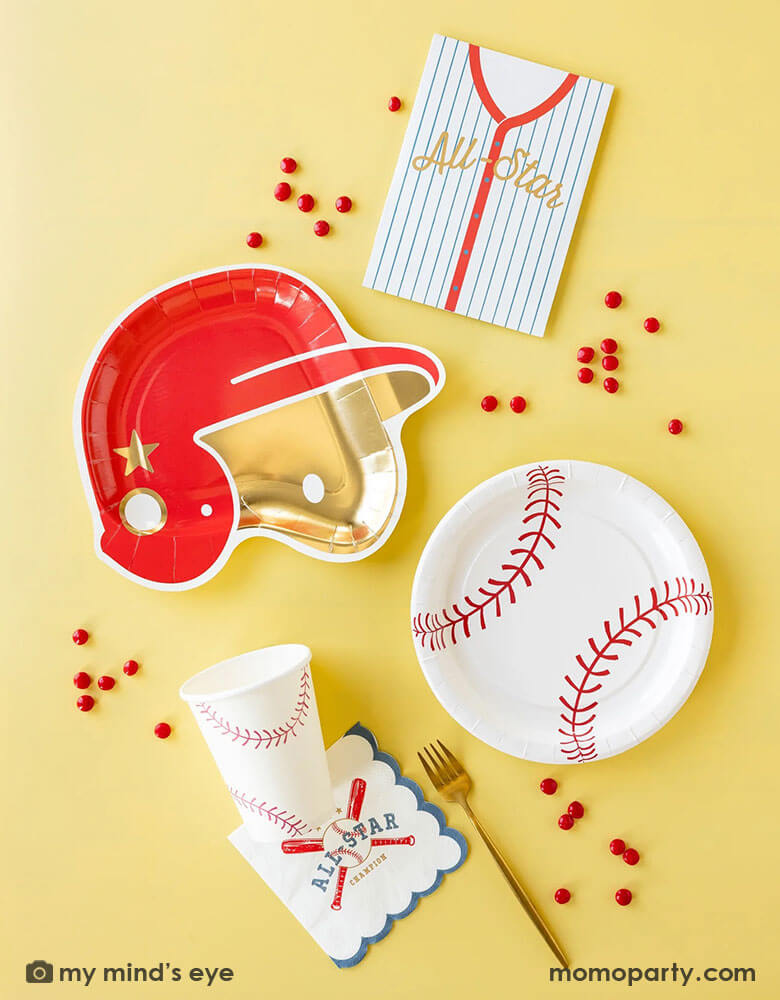 A baseball themed party collection by Momopartys featuring baseball paper tableware by My Mind's Eye, including baseball shaped plates, baseball red helmet shaped plates, baseball all star small napkins, baseball treat bags and baseball party cups, along with some red candies around these partyware, this makes a great inspiration for kid's baseball themed birthday party decoration ideas.