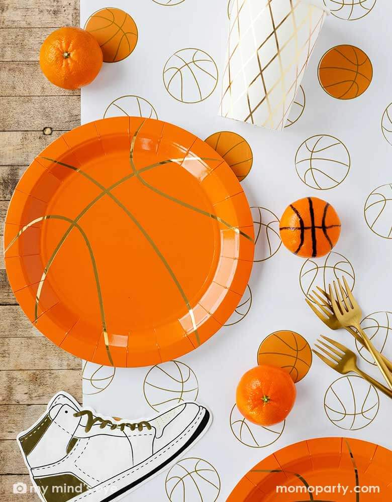  Analyzing image     Basketball-Party-Table_Momo-Party  780 × 1000px  A basketball themed party table features Momopartys's basketball tableware by My Mind's Eye including basketball shaped plates, hightop sneakers shaped napkins, basketball net gold foil party cups and paper basketball table runner, with oranges as snacks on the table - a perfect table setting inspo for kid's basketball themed birthday parties or a fun NBA viewing party!