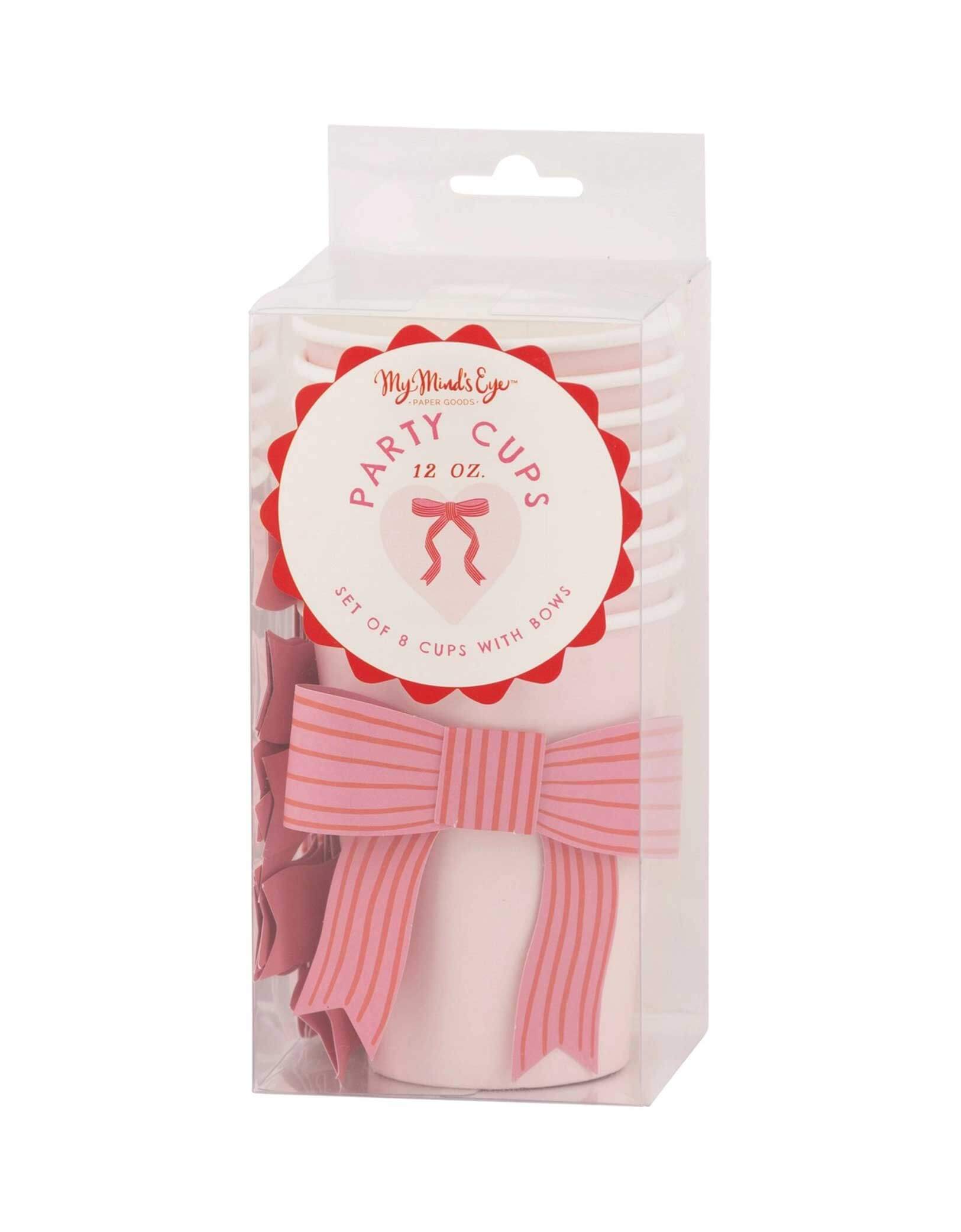 The package of Momopartys's 12 oz Bow Party Cups by My Mind's Eye.  This quirky cup features a playful valentine's bow, adding a touch of charm to your party. Don't just settle for any old cup, make a statement with this unique and fun option. Cheers to love! 