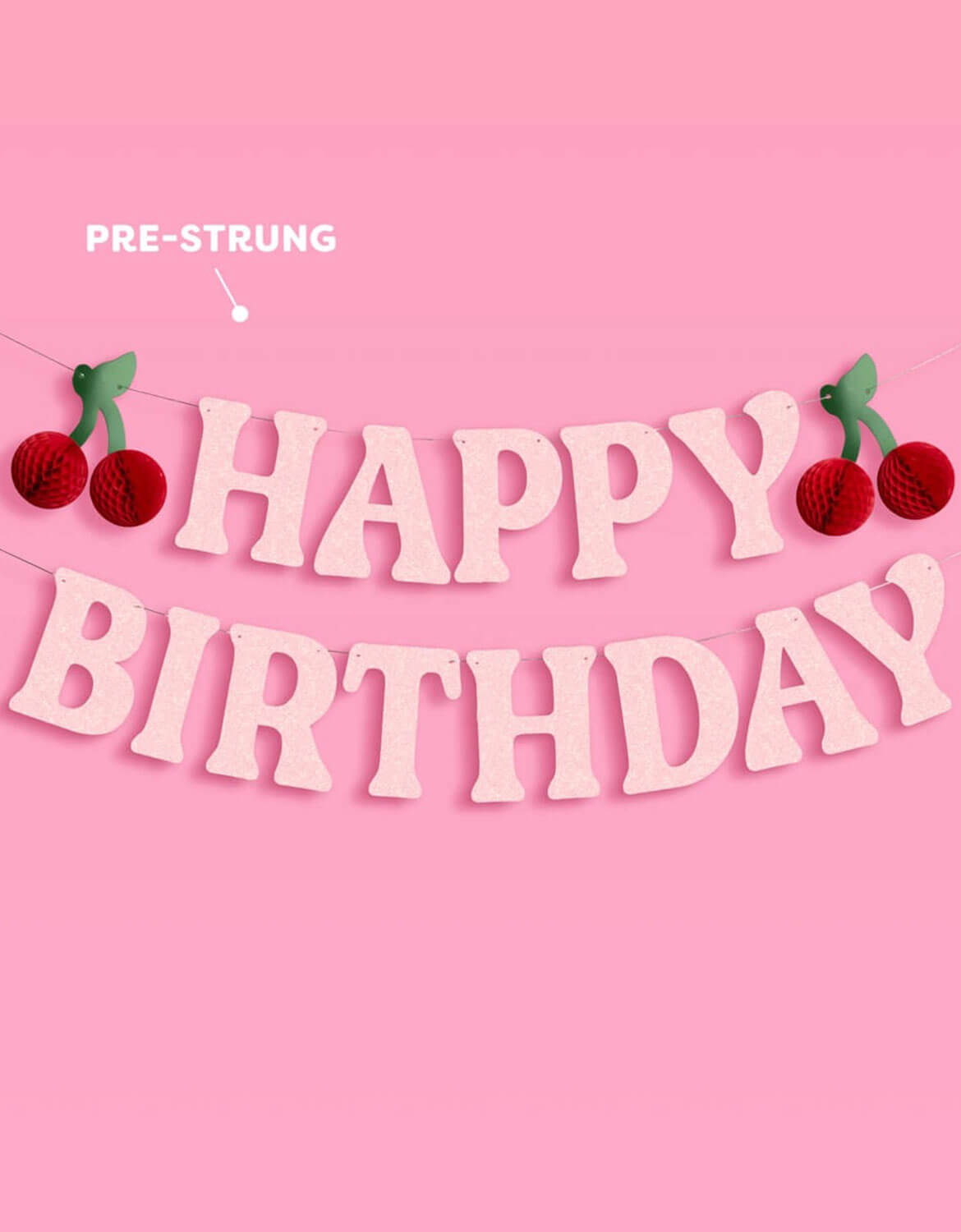 Momo Party's 4.5' pre-strung cherry happy birthday banner with cherry honeycomb decorations on a pink background.