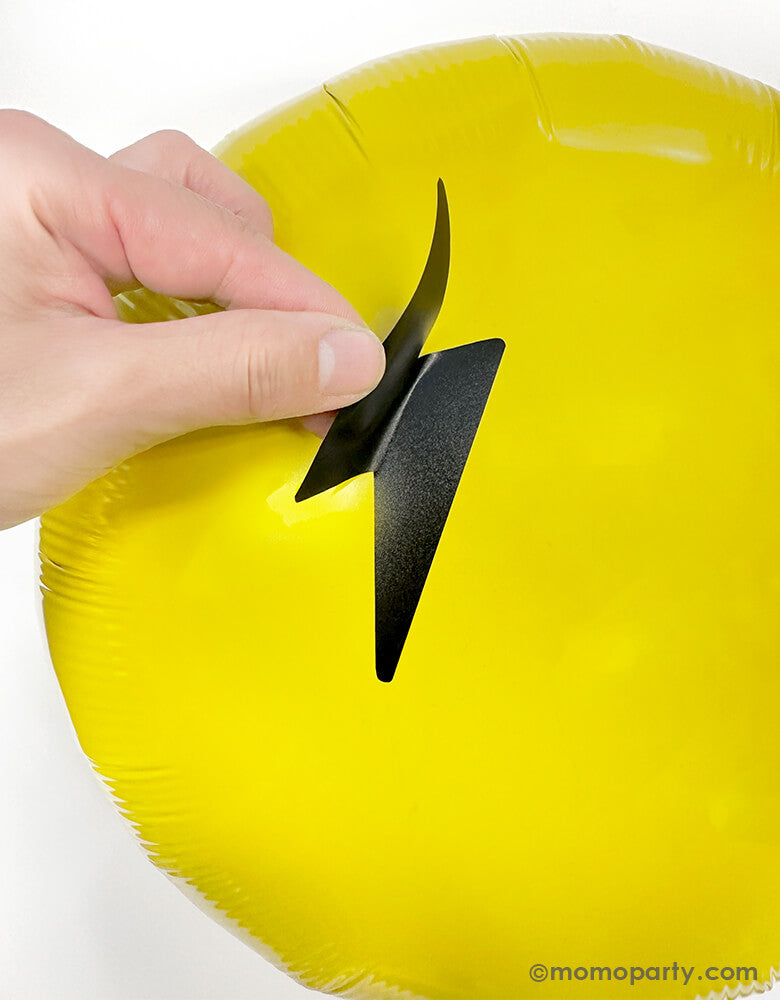 Discover the Cool Dude Smiley Foil Balloon Kit by Momopartys. This kit includes an 18" yellow round foil balloon adorned with lightning bolt eyes and a smiley face vinyl sticker. Simply inflate the round foil balloon and apply the stickers to the center to create a super rad decoration! Perfect for a boy's 'One Happy Dude' themed first birthday, a 'Two Cool' themed second birthday party, 'Ten Rad Years' 10th birthday celebration, or any modern kids birthday party and celebration.
