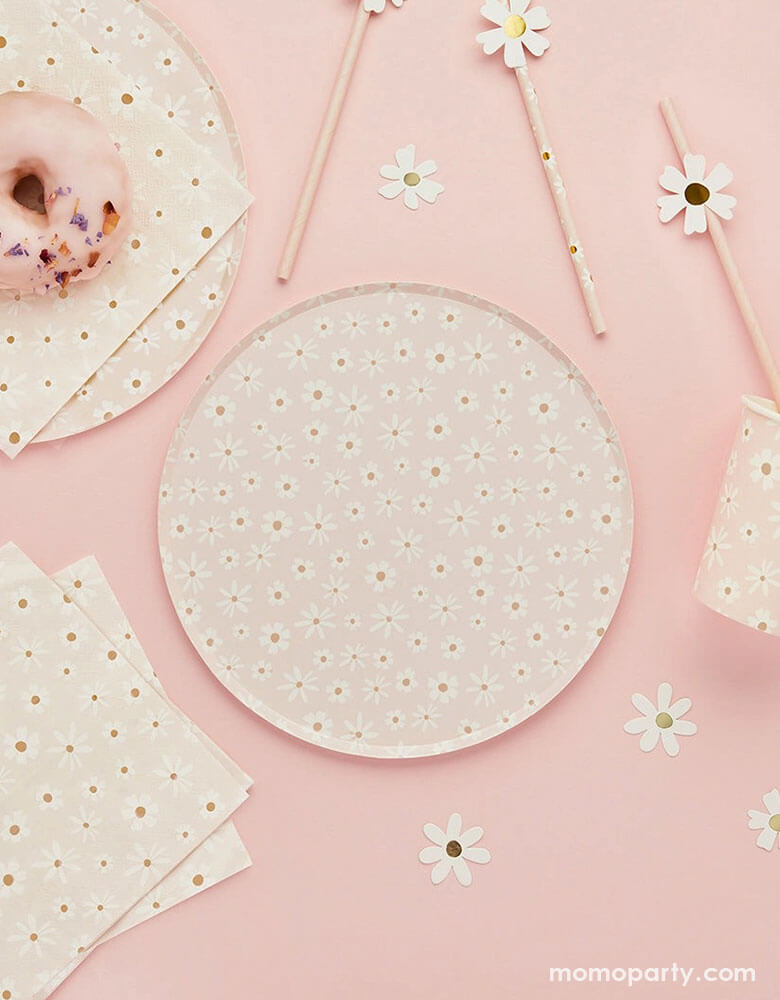 A pale pink table features Momopartys's daisy flower collection including daisy flower round plates, large napkins, daisy flower paper straws and daisy shaped paper confetti by Hooty Balloo - a perfect addition to your spring inspired celebration including Easter parties or Mother's Day celebration.