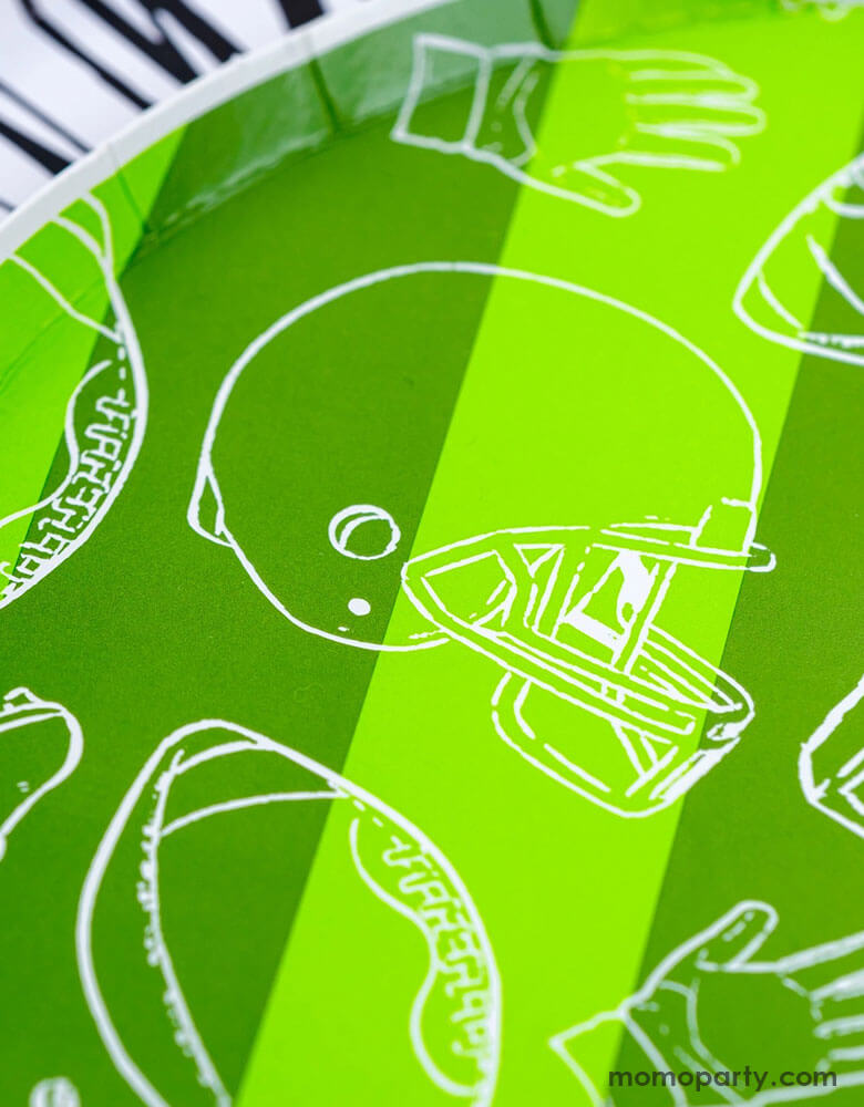 A closer look of Momopartys's 8.5" Touchdown Dessert Plates by Gatherings. Elevate your game day celebration with these touchdown plates! These sturdy and stylish plates are the perfect addition to your football-themed party. With a unique design and high-quality materials, you and your guests can enjoy your favorite treats with ease. Score a touchdown with these plates and make your party a winner!