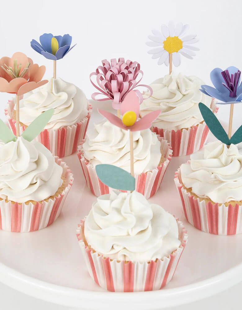 Some cupcakes decorated with Momopartys's flower garden cupcake kit which features beautiful hand crafted flowers toppers and striped cupcake cases, this gorgeous cupcake kit is a perfect addition to your spring inspired celebration or garden, floral themed birthday party.