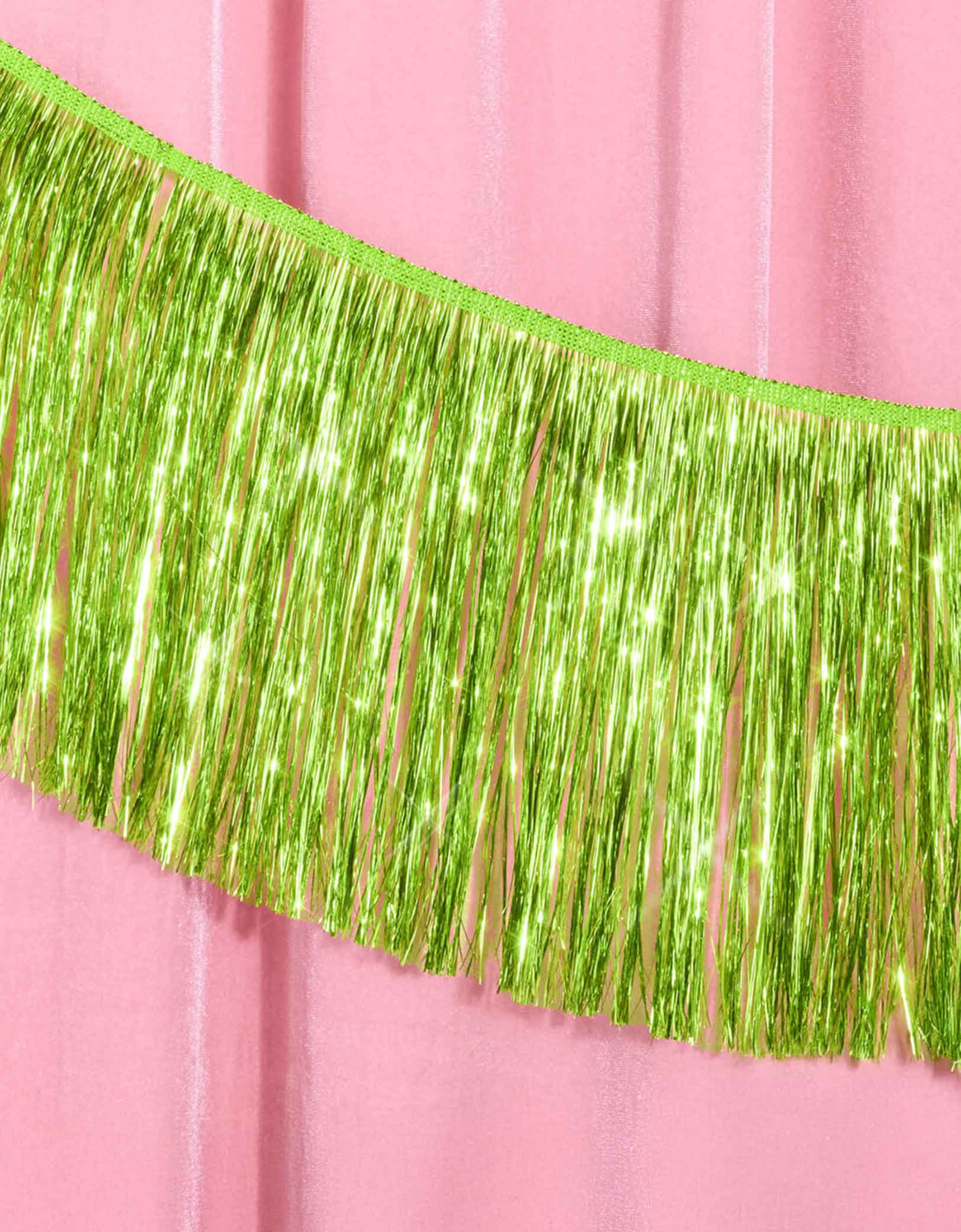 Momo Party's 4.43 feet Lime Green Fringe Garland by Xo, Fetti.  Perfect for any celebration, it'll add just the right touch of shimmer. You'll love it for Wicked themed celebration or kid's safari, dinosaur themed birthday parties!