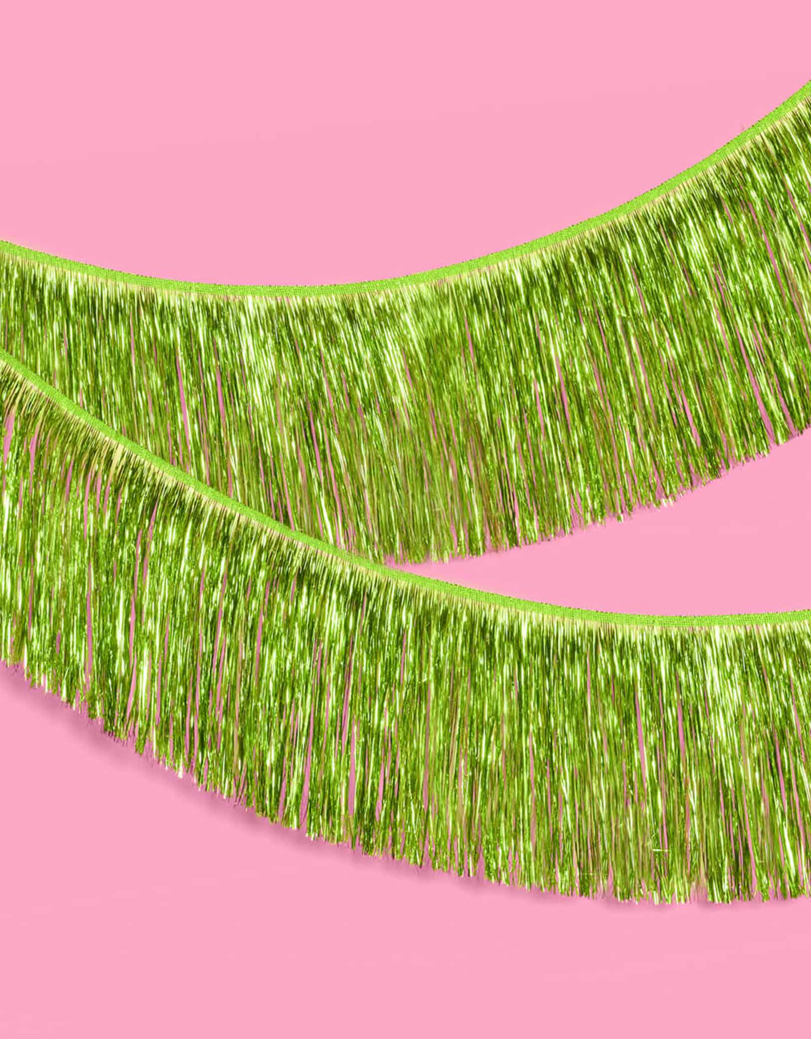 Momo Party's 4.43 feet Lime Green Fringe Garland by Xo, Fetti.  Perfect for any celebration, it'll add just the right touch of shimmer. You'll love it for Wicked themed celebration or kid's safari, dinosaur themed birthday parties!