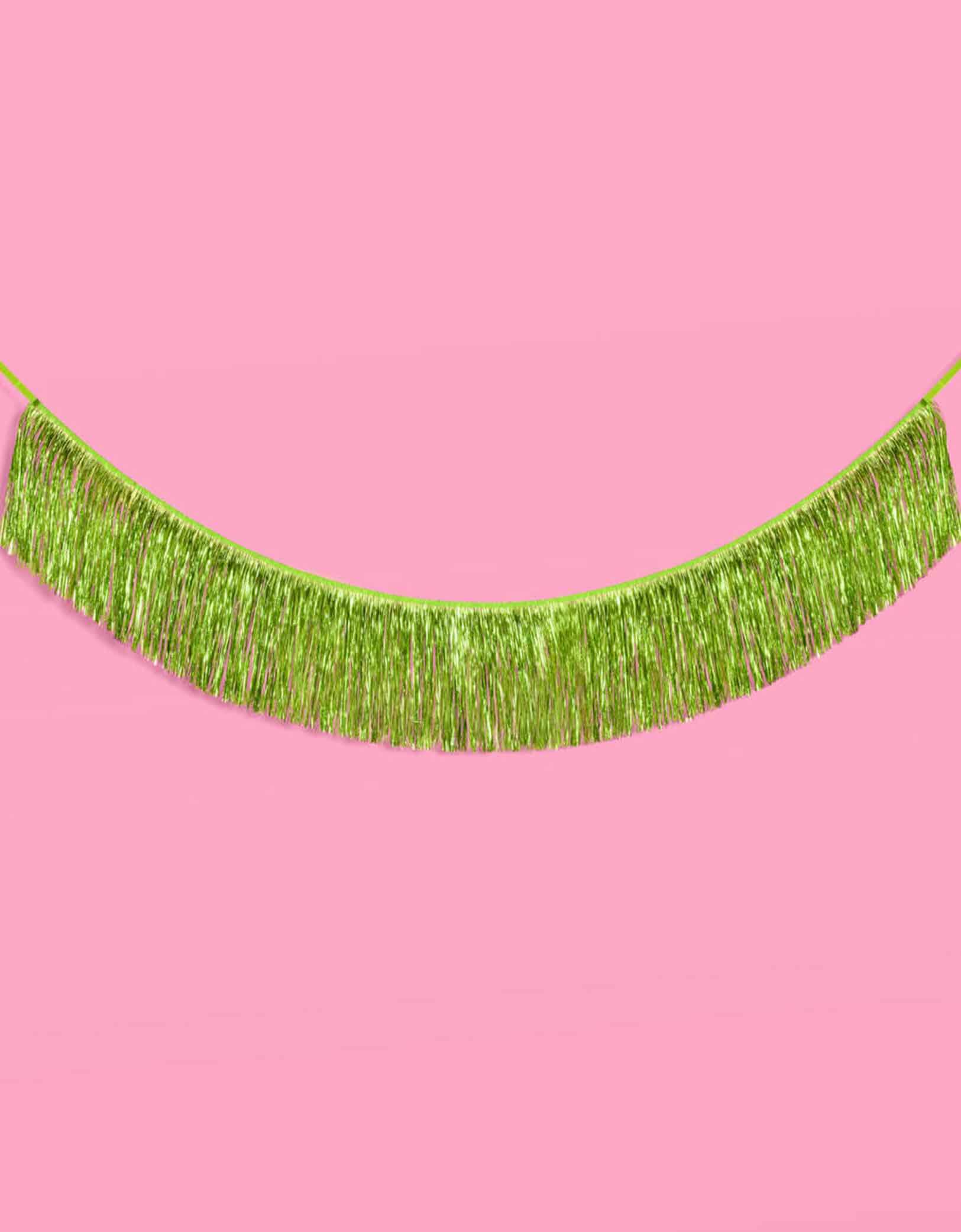 Momo Party's 4.43 feet Lime Green Fringe Garland by Xo, Fetti.  Perfect for any celebration, it'll add just the right touch of shimmer. You'll love it for Wicked themed celebration or kid's safari, dinosaur themed birthday parties!