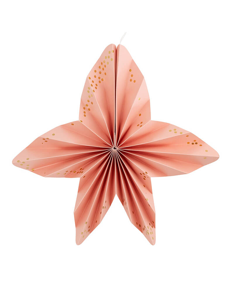 A close up shot of the peach seastar shaped shaped paper fan from Momopartys's Under the Sea Fan Set by My Mind's Eye. Comes in a set of 6 paper fans 6 fans of size 14", 8.5", 8", 7", and 5.5" in pastel colors of aqua, pink, lilac, teal, cream and peach, this mermaid-inspired fan set will add an enchanting touch to any under the sea themed celebration. Bring the ocean to your event and create a memorable atmosphere.