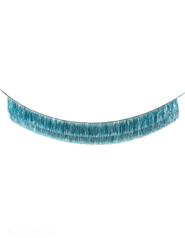 Momo Party's 6ft Blue Tinsel Fringe Garland by Meri Meri. Includes 2 layer tinsel fringe and silver ribbon ties, it's perfect for any celebration, or you can use it to decorate any room where you want style and shine.