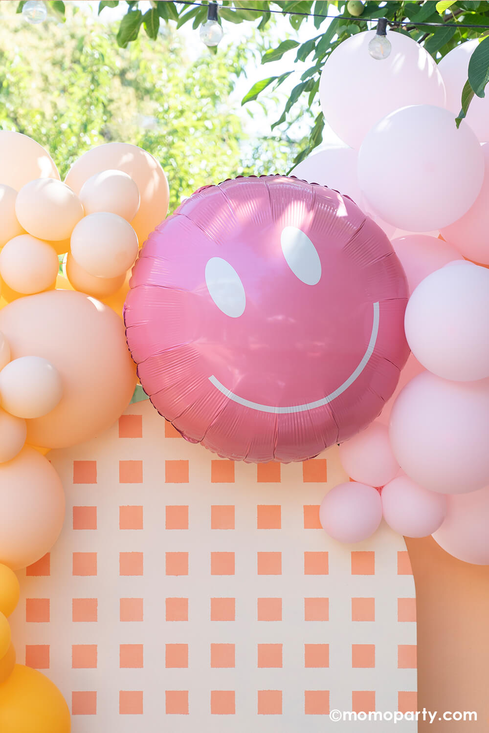Momopartys One Groovy Baby First Birthday Party Backdrop board with 30" Rosy Smiley face foil balloon by Tuftex Balloons, latex balloon decorations with peach, pink, goldnod colors. This decoration is such a stand out backdrop and photo booth for a Groovy birthday parties, baby showers, and most any other joyful event