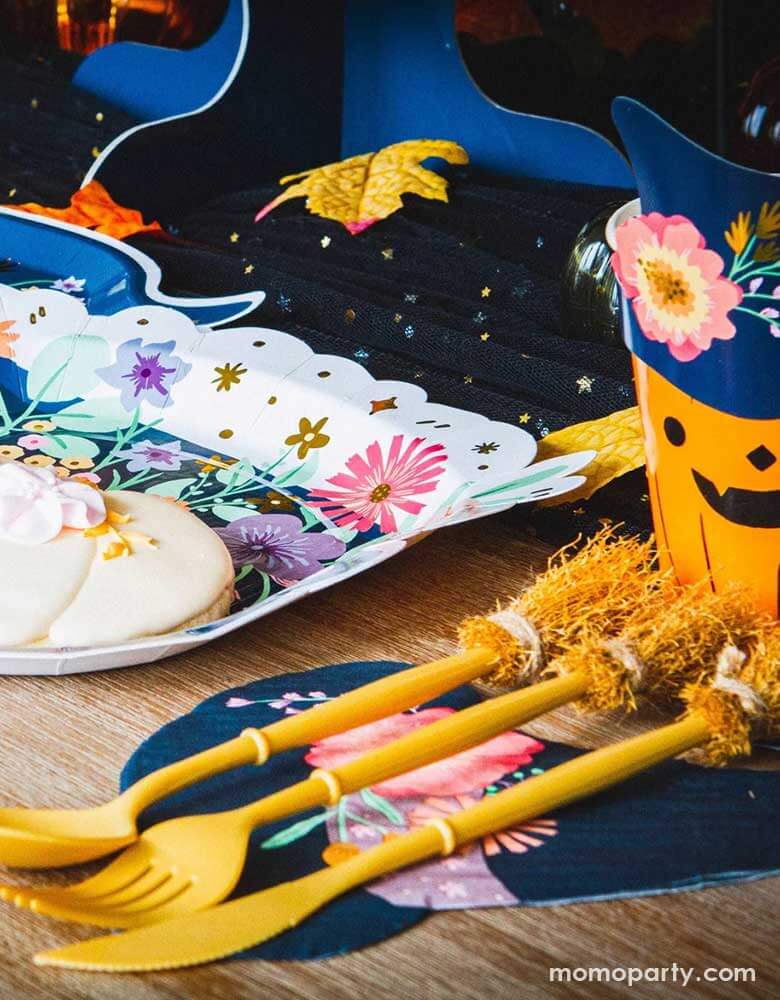 Momo Party's Witch's Broom Cutlery Set and Witch's Hat Shaped Napkins by Ma Fete. Witch’s broom inspired set of disposable cutlery to make tasty Halloween treats even more fun! Perfect for little witches and wizards to enjoy party snacks alongside our matching cups and plates for a truly spooky eating experience!