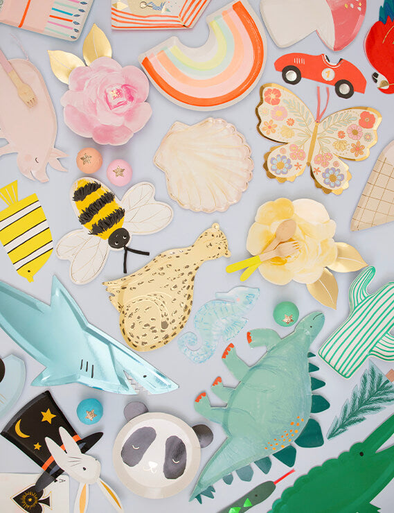 Table fill with Meri Meri Fun die cup party plates of Dinosaur, Cheetah, Shell, Bee Flowers, Butterflies, Cactus, and Napkins, sale by Momopartys online boutique store 