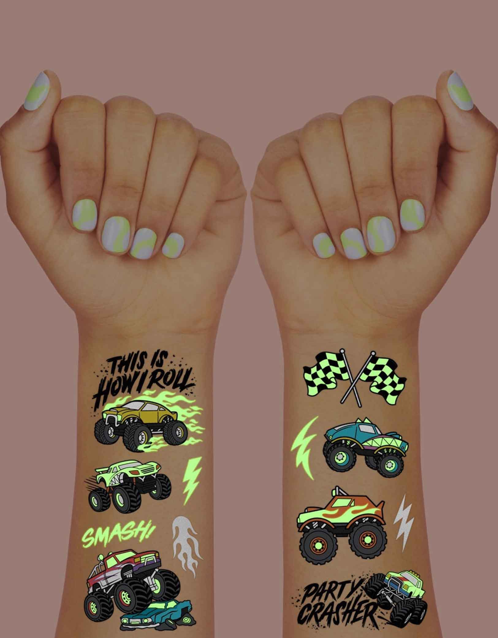 Two arms decorated with Momopartys's 8.25" x 6" Monster Truck Glow in the Dark Kids Temporary Tattoos by xo, fetti. Comes in a set of 50 tattoos, these awesome glow-in-the-dark Monster Truck temporary tattoos are guaranteed to be a wheel good time at your kid's Monster Truck birthday party! 50 designs means nobody gets left behind - invite all of your bffs to crash this party because these tats are sure to be fire!