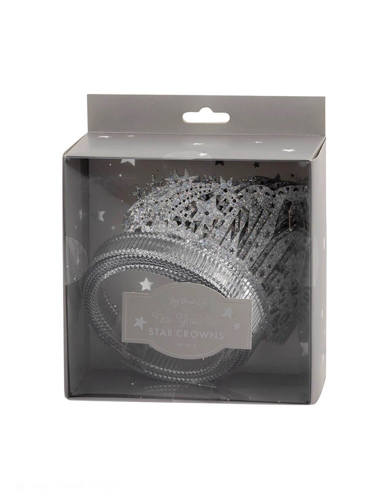 The silver packaging box of Momopartys New Year's Eve Crown Headbands by My Mind's Eye. Get ready to sparkle and shine on your next New Year's Eve party with these gorgeous silver glittered NYE crown headbands. This festive accessory will elevate any holiday outfit and make you feel like a true party queen. Join in on the countdown fun with this must-have headband!