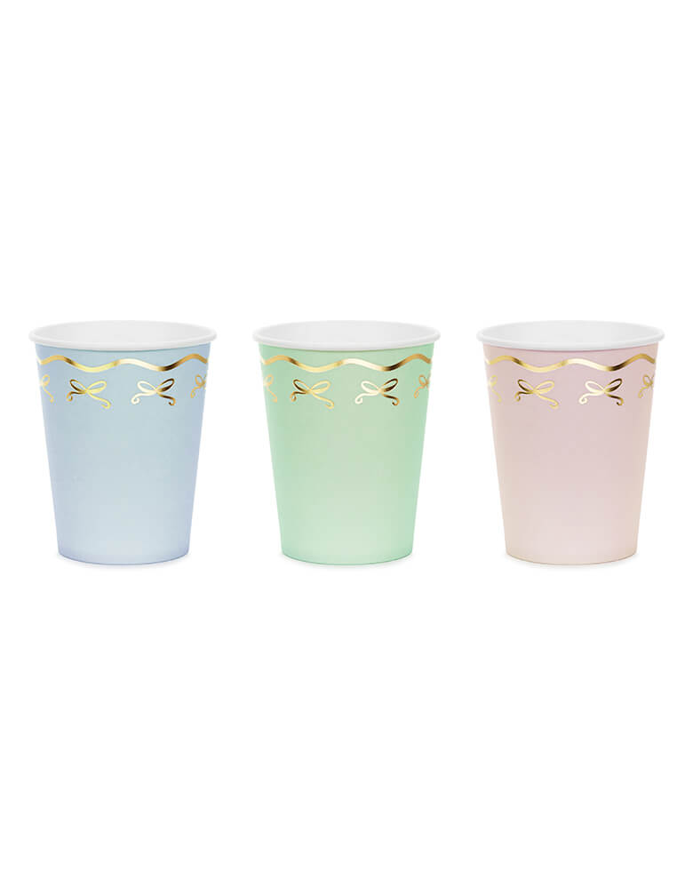 Momopartys 7.4 oz Pastel Coquette Bow Cups by Party Deco. Comes in a pack of 6 party cups in 3 pastel colors, add an elegant touch to your party with these gorgeous pastel coquette bow cups. These charming paper cups feature soft pastel colors and a delicate gold foil coquette bow design. Perfect for any celebration, these cups are sure to impress your guests.