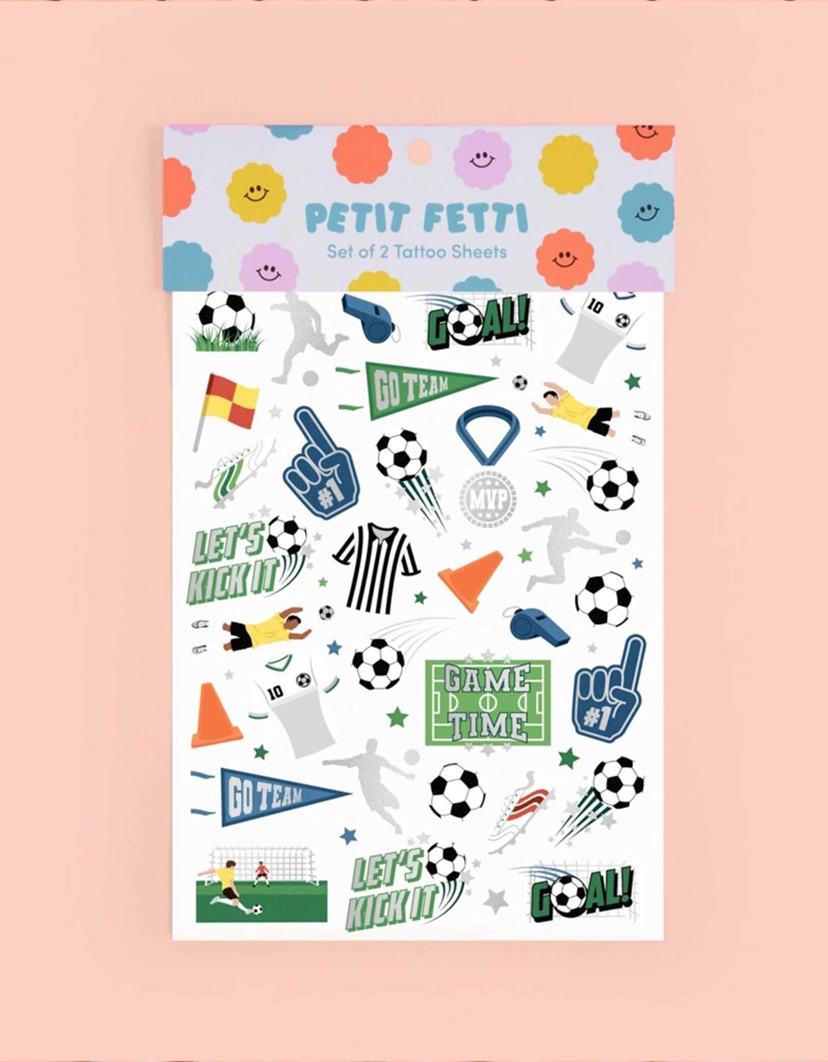 Two arms decorated with Momopartys's Soccer Kids Temporary Tattoos by Xo, Fetti. Comes in a set of 54 tattoos in soccer themed designs including soccer balls, MVP medals, soccer fields, soccer cleats, soccer jerseys, training cones, soccer players, these soccer temporary tattoos are great for kid's soccer themed birthdays or a watching parties.