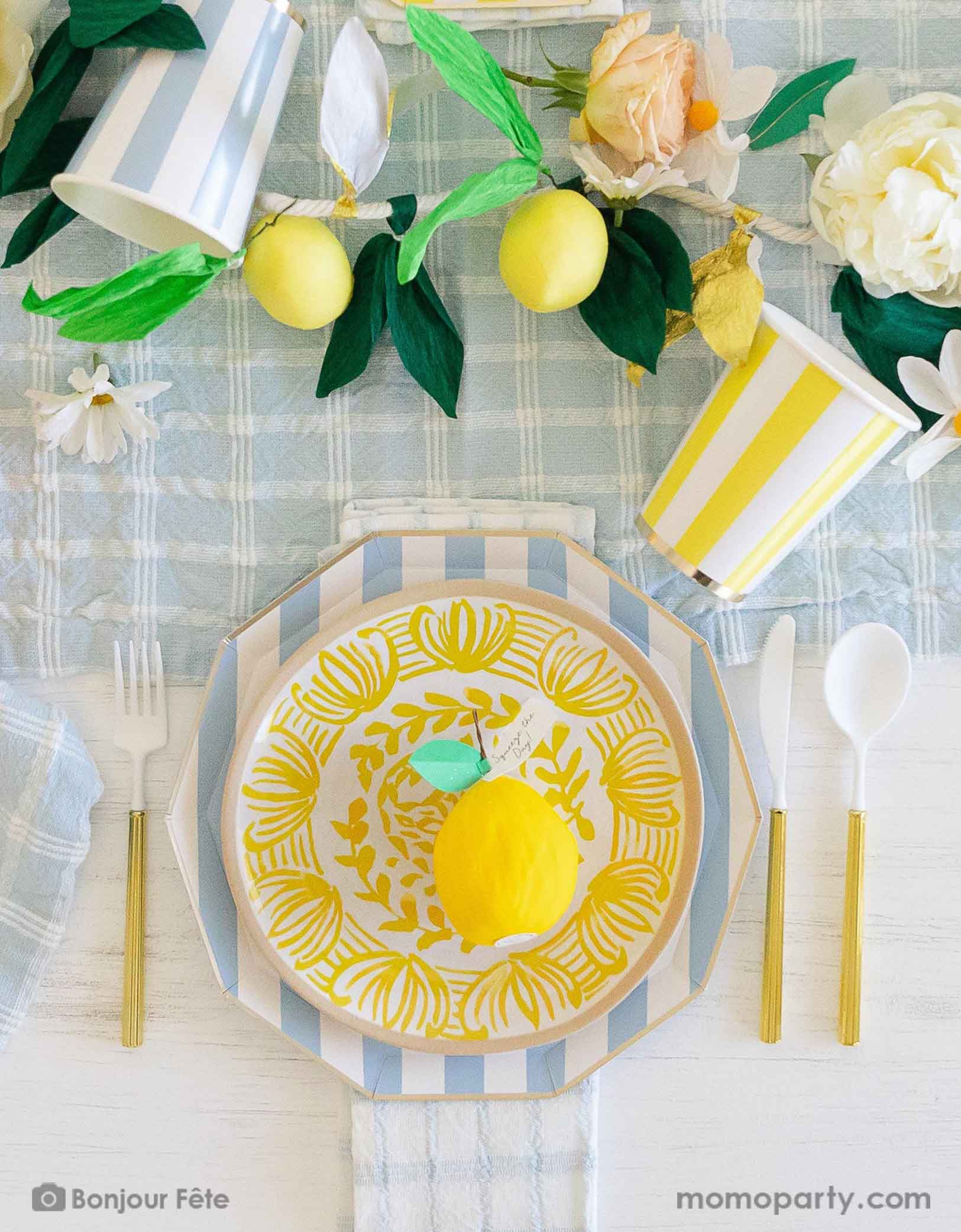 A stunning tableset in a Summer Party Capri Inspired party by Momopartys! Bursting with colors and textures, this stylish setting combines the vibrant striped aesthetics in yellow and sky blue of Capri with the refreshing citrus vibes of lemons and gingham checker patterns. Your guests will be transported to a picturesque seaside Italian village as they enjoy their summer feast underneath these enchanting decorations. Check out momopartys.shop for more themed party supplies and decorating ideas!