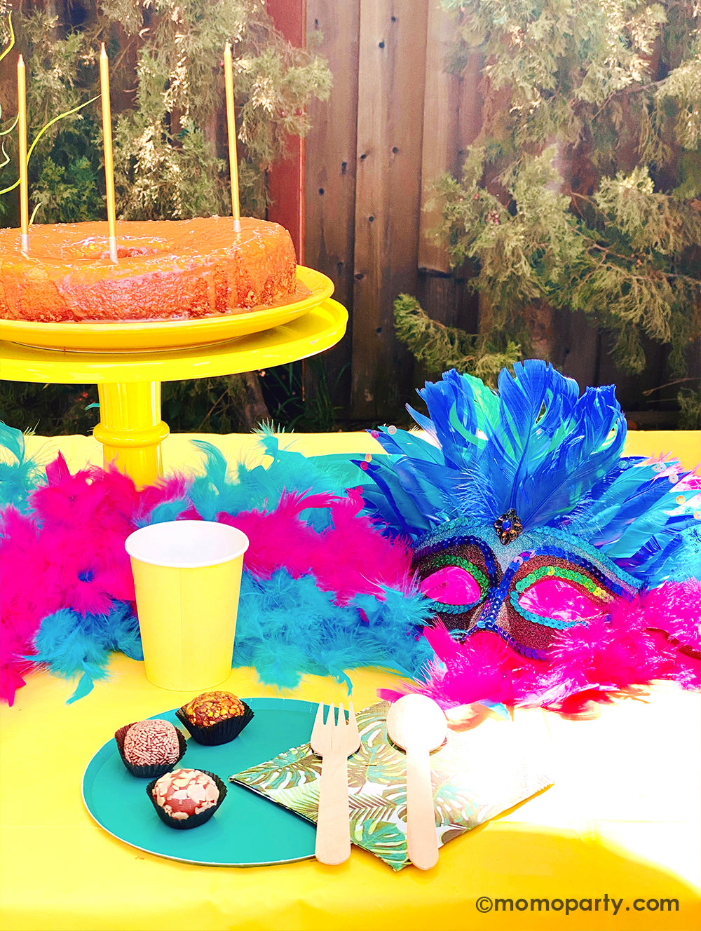 Get ready to throw the ultimate summer celebration with a vibrant Brazilian Carnival-themed party table! Featuring tropical party supplies from Momopartys, this festive setup includes palm leaf napkins, matching plates, and colorful party cups that bring the rainforest vibe to life. Complete the look with feather garlands, carnival masks, decadent chocolate desserts, and a stunning birthday cake. Whether it's for a birthday, summer bash, or themed event, this tropical party setup is perfect for summer!