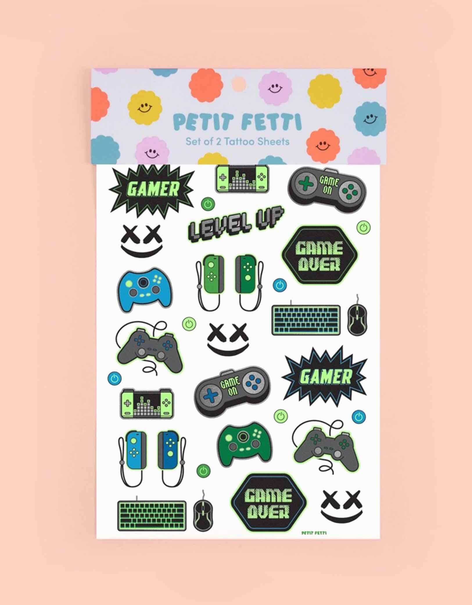Video Gamer Glow in the Dark Kids Temporary Tattoos by xo, Fetti. Comes in a set of 40 tattoos, these glow in the dark video game temporary tattoos are the perfect kids after school activity or a video game themed party accessory! 40 designs including game controllers, game devices, level up, game over signs means no gamer gets left behind - call all the players, its game on!