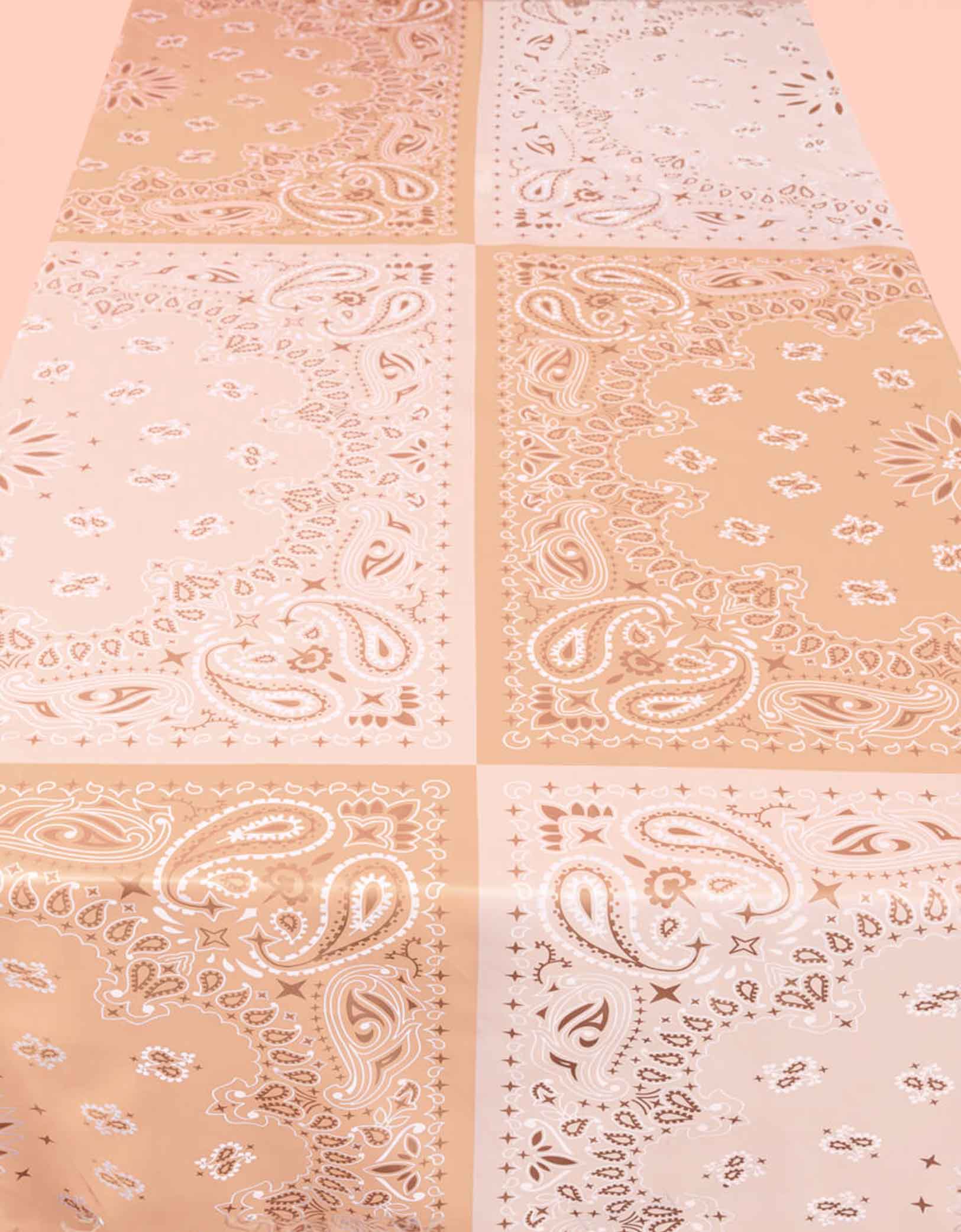 Momo Party's 9' x 4' Wild Wild West Washable Tablecloth by Xo, Fetti. With peach shade bandana design, this table cover is made with 100% machine wash friendly polyester. It's perfect for a western themed celebration for all cowboys and cowgirls! This tablecloth is guaranteed to get the party as wild as the wild wild west! Saddle your horse and invite all of your rodeo partners because this party is about to get wild!