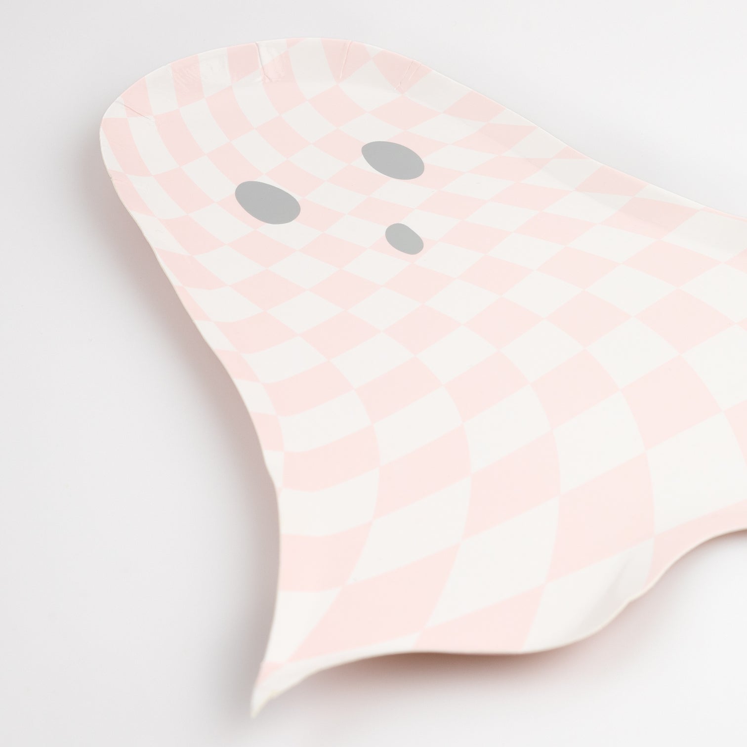 Details of Meri Meri 10.125 x 9.25 inches pink checkered ghost shaped plates, sold by Momopartys. Comes in a set of 8 plates, these pink ghost shaped plates with checkered pattern are chic and stylish, perfect for a pink Halloween themed party.