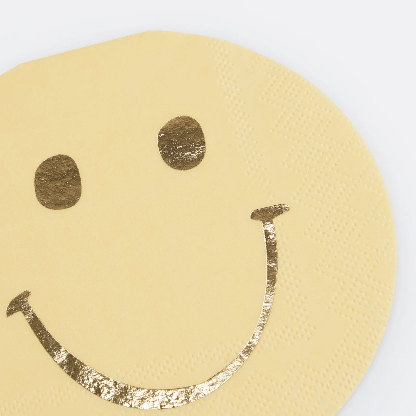Details of A smiley face with gold details die-cut napkin from Momopartys's Happy Face Icons Diecut Napkins by Meri Meri.  This set of napkins are perfect for any happy celebration. Be it a groovy themed party or a retro nostalgia themed celebration.