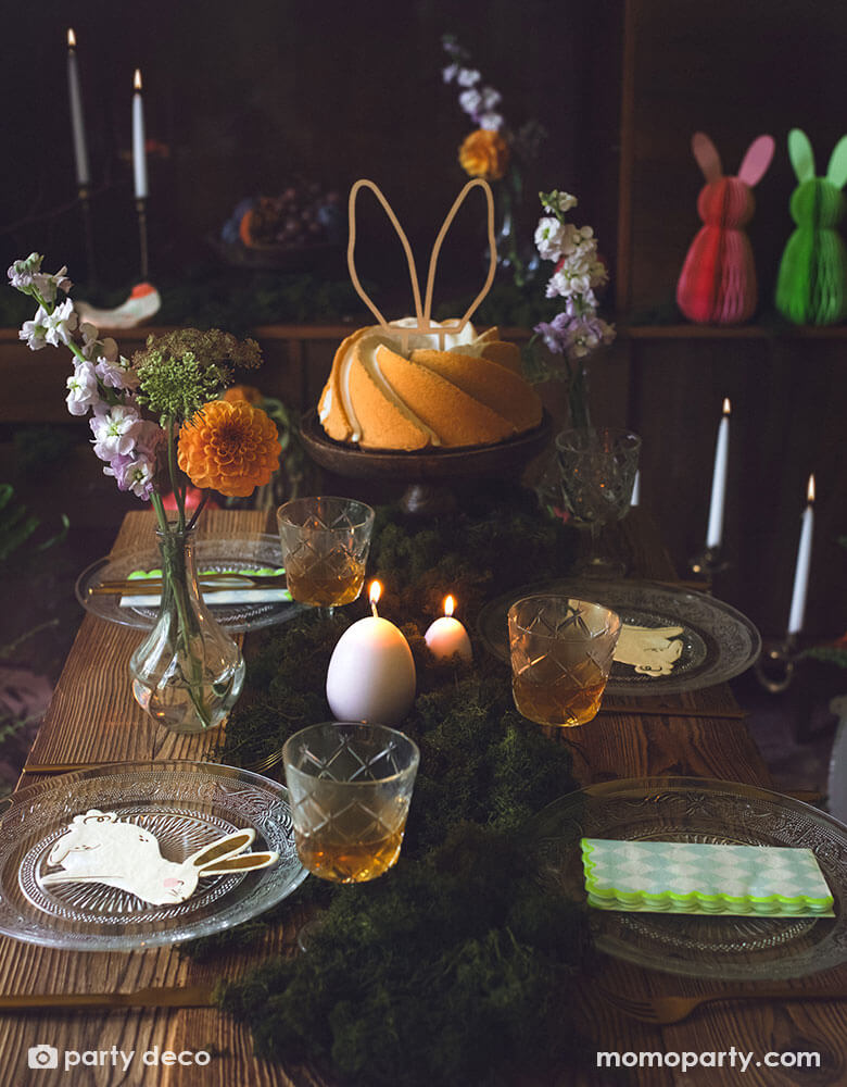 A beautiful rustic Easter table decorated with lots of spring flowers and honeycomb carrot and Easter egg decorations as centerpiece, with Momopartys's 5 x 6.3" bunny napkins by Party Deco, it makes a great inspiration for an adorable kid's Easter tableset.