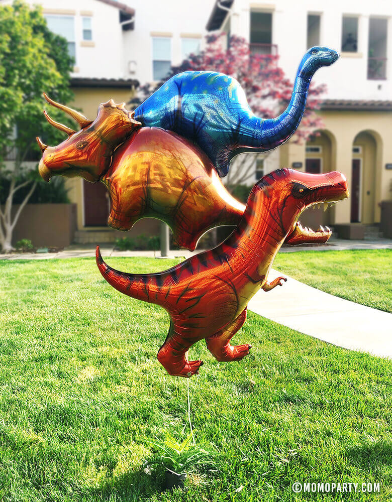 Kid dinosaur Party with Giant Dinosaur Mylar Balloons of T-REX Mylar Balloon, Blue Apatosaurus, and Stegosaurus Mylar Balloons