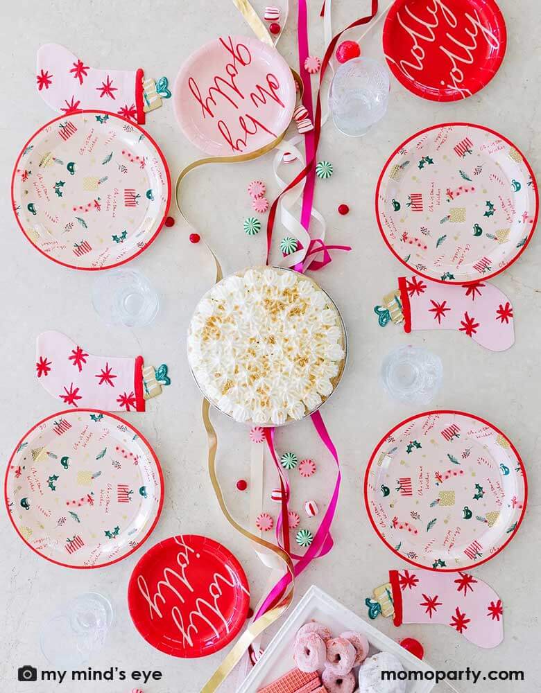 Set a pretty holiday party table with My Minds Eye’s pink stocking napkins with charming colors and art!Cute die cut stocking shape is soft and whimsical and a beautiful table piece. Modern pink colored napkin has red starbursts, stuffed toy with gold foil accents and a green bow! 18 napkins sized 4.5 x 6.5 inches pair beautifully with Christmas wishes, holly jolly and oh by golly plates at momopartys.shop. Add peppermint twists, kisses, candycane, hot cocoa marshmallows and desserts for a cozy holiday table.