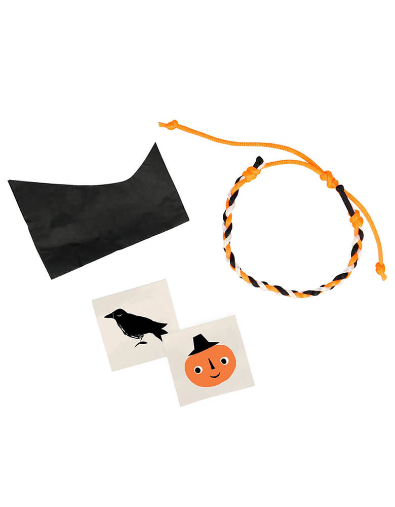 Meri Meri Black and Orange Classic Halloween Spider Surprise Ball. These surprise balls are crafted from layers of crepe paper, inside includes a Halloween friendship bracelet, presented in a plastic ball, 2 tattoos, a joke and a tissue paper hat. These spider surprise balls will look absolutely amazing on your Halloween party table, or popped into a party bag as a treat to delight your kid guests. Unwrap the layers to reveal the hidden gifts!