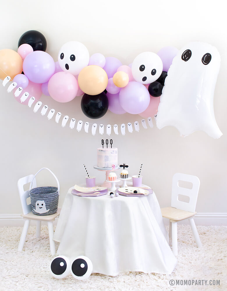 Momopartys 2020 Halloween Boo To You Party Look with: Halloween Ghost Mylar Balloon, Pastel pink and purple balloon garland, Boo To You Ghost Banner as wall decoration, Table set up with Lilac Dinner Plates and Tumbler Cups, Iridescent Ghost Plates, Holographic Ghost Napkins, pink cake with Boo letterboard cake topper, 2 Friendly Eyeball latex Balloons as an eye, Inspire ideas for you Kids Halloween Party, Pink Halloween, Not too Spooky birthday party, Hocus Pocus party, spooktacular halloween party
