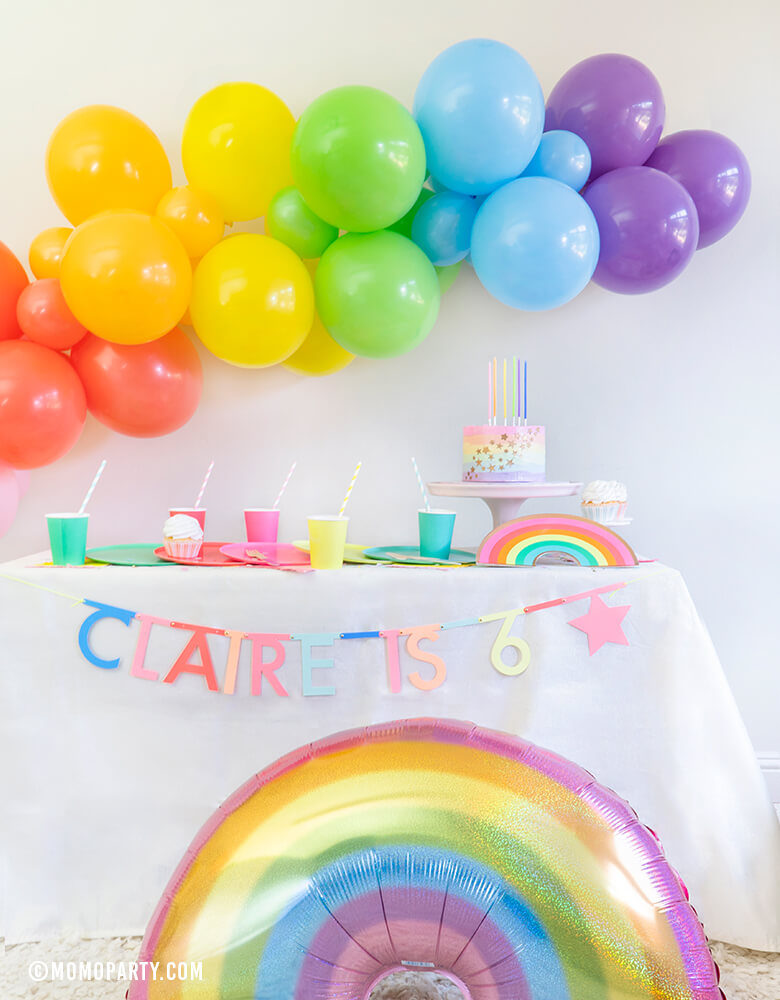 Rainbow theme Modern birthday Party, Momopartys in a box included Oh happy Day Large Rainbow Plate Set, Oh happy day Rainbow Plates, Rainbow Cup Set, My minds Eye's Hip Hip Hooray Fringe Small Napkins, Hyper Tropical Wooden Cutlery Set, Mixed Pastel Striped Straws, Holographic Pastel Glitter Rainbow Foil Balloon, Mixed Rainbow colored Balloon Garland, for a girl's 6 years old Rainbow themed birthday party