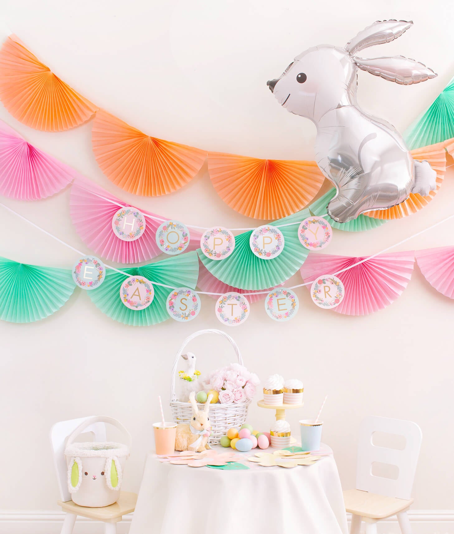 Momopartys Easter Party celebration box with Bunting Fan Garlands, Rifle Paper Garden Party Letter Garland, Woodland Bunny Foil Mylar Balloon as decoration, and Pastel Daisy Large Plates, Pastel Cups, Leaf Napkins and Easter Basket for dessert table