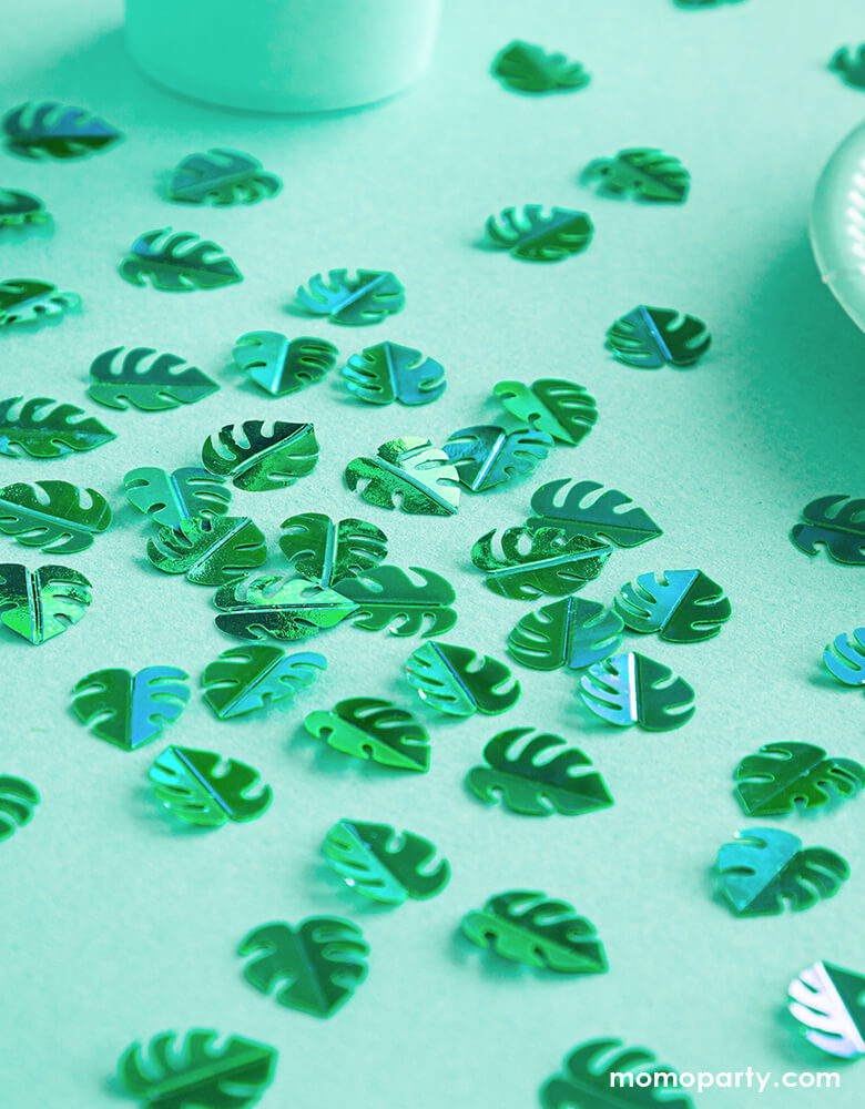 Party Deco Green Palm Leaf Confettis on a dinosaur themed party table with green table cloth. This confetti features Palm leaf shape cutouts with green foil. Add some fun to your jungle, dinosaur or tropical themed party by spreading this set of palm leaf confetti in metallic green to your table! party supply accessories Sold by Momopartys store provided modern party supplies, boutique party supplies, chic holiday party supplies and high end party supplies