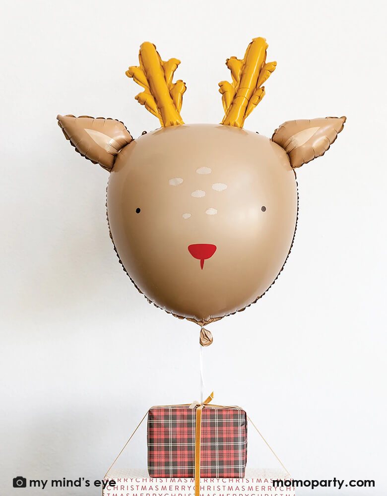 Adorable Rudolph the red nosed reindeer balloon by My Minds Eye for a delightful christmas celebration. Party decor that will be loved by kids and adults, this reindeer balloon will set a joyful and merry mood as you wait for Santa Claus and reindeers. Decorate your home easily with this lovable reindeer balloon 26 inch in size. The red and gold colors work beautifully with other Christmas ornaments, forest winter and gingham decor at momopartys.shop. Great fun for kids when set next to Christmas gifts.